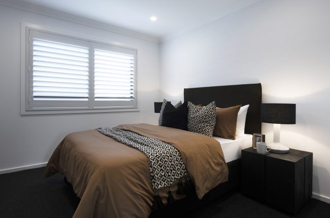 Cayman 287 bedroom with brown bedspread and geometric accessories