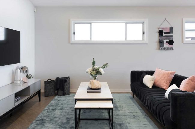 Southport 217 living room with black suede couch