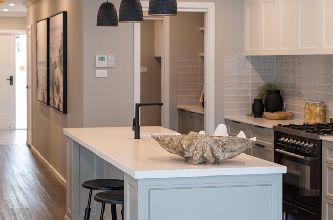 open plan kitchen with shell-style bowl on counter