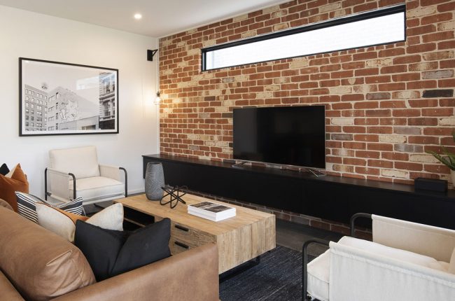 Cayman 349 living room with brick feature wall