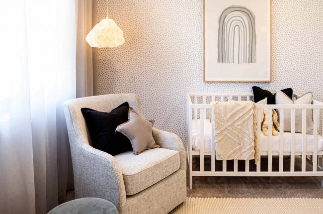nursery with wallpeper and cloud pendant