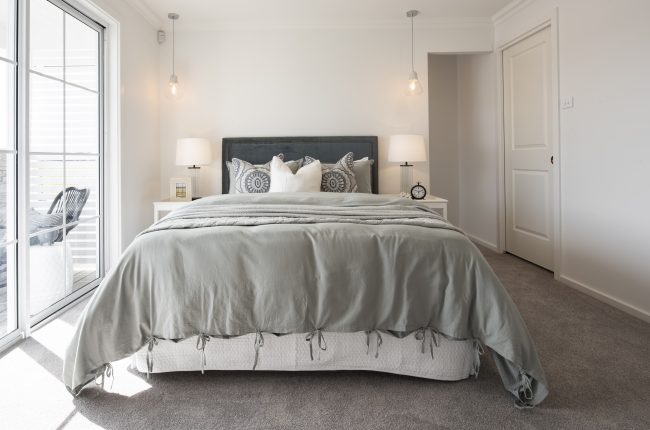 Whitehaven 238 master bedroom with pendant lighting and balcony