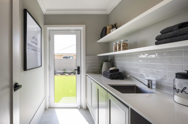 Avoca 210 laundry with long tiled splashback