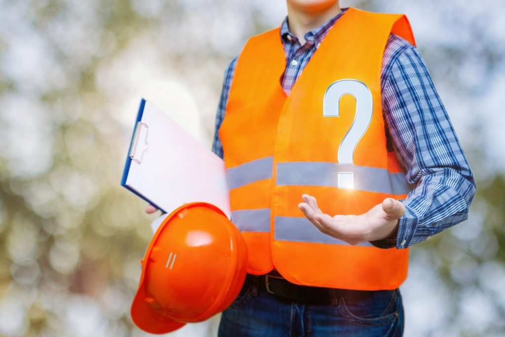 Home builder holding clip board and question mark