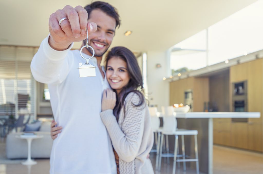 couple getting the keys to their new home