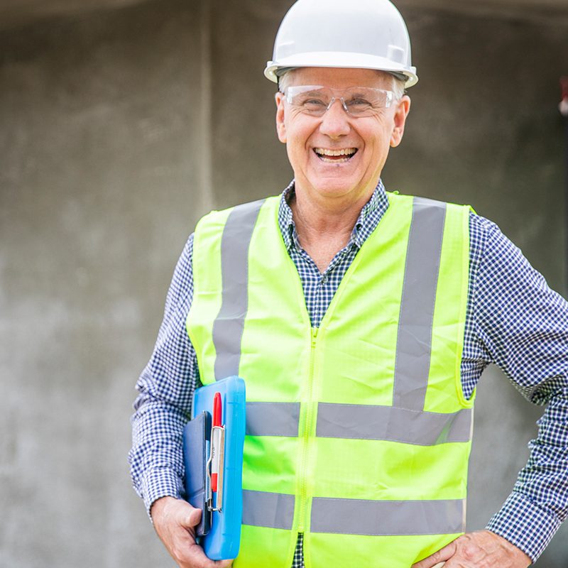 inspector in high vis with clipboard